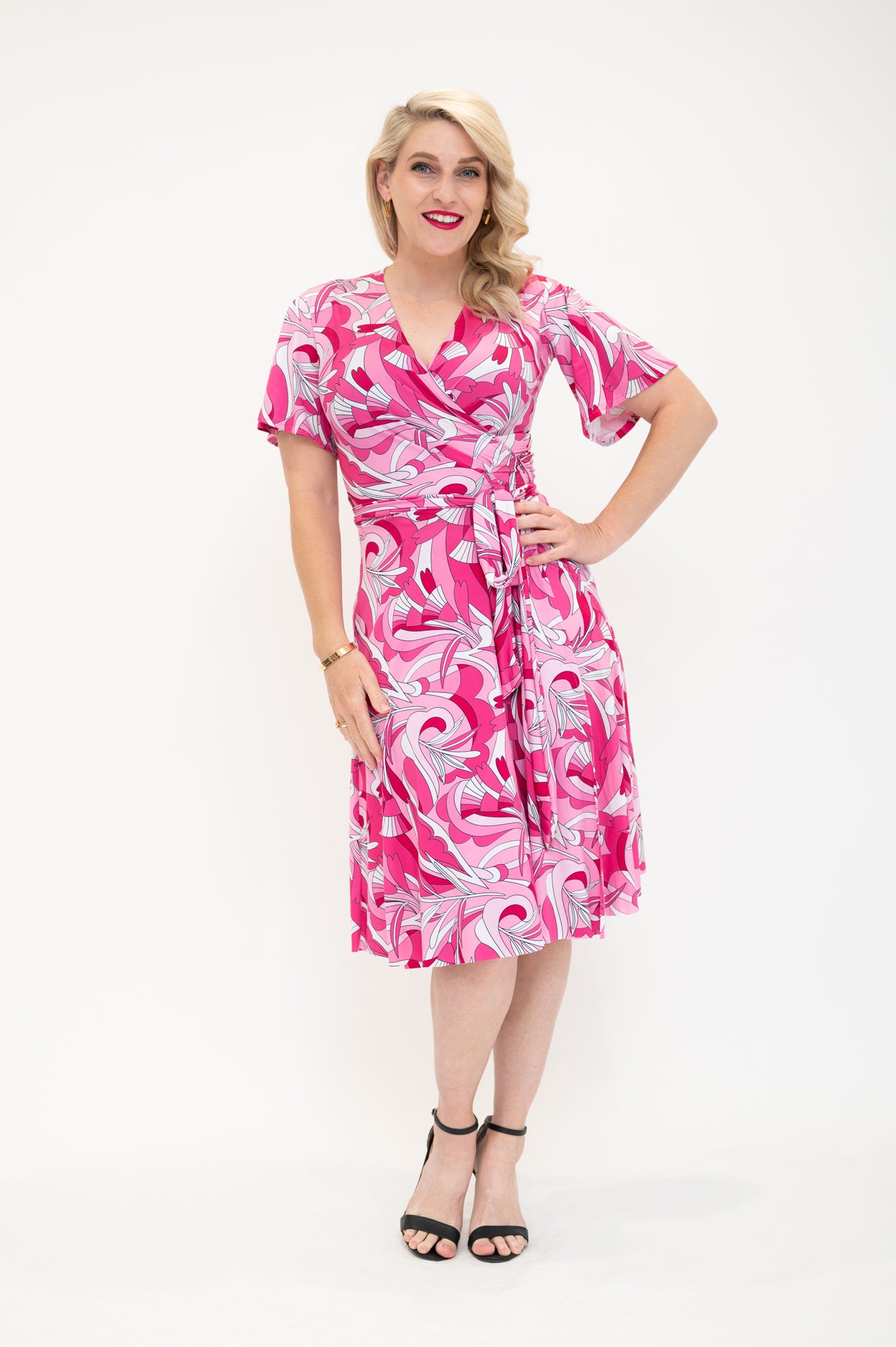 knee length  wrap dress with flutter sleeves  pink