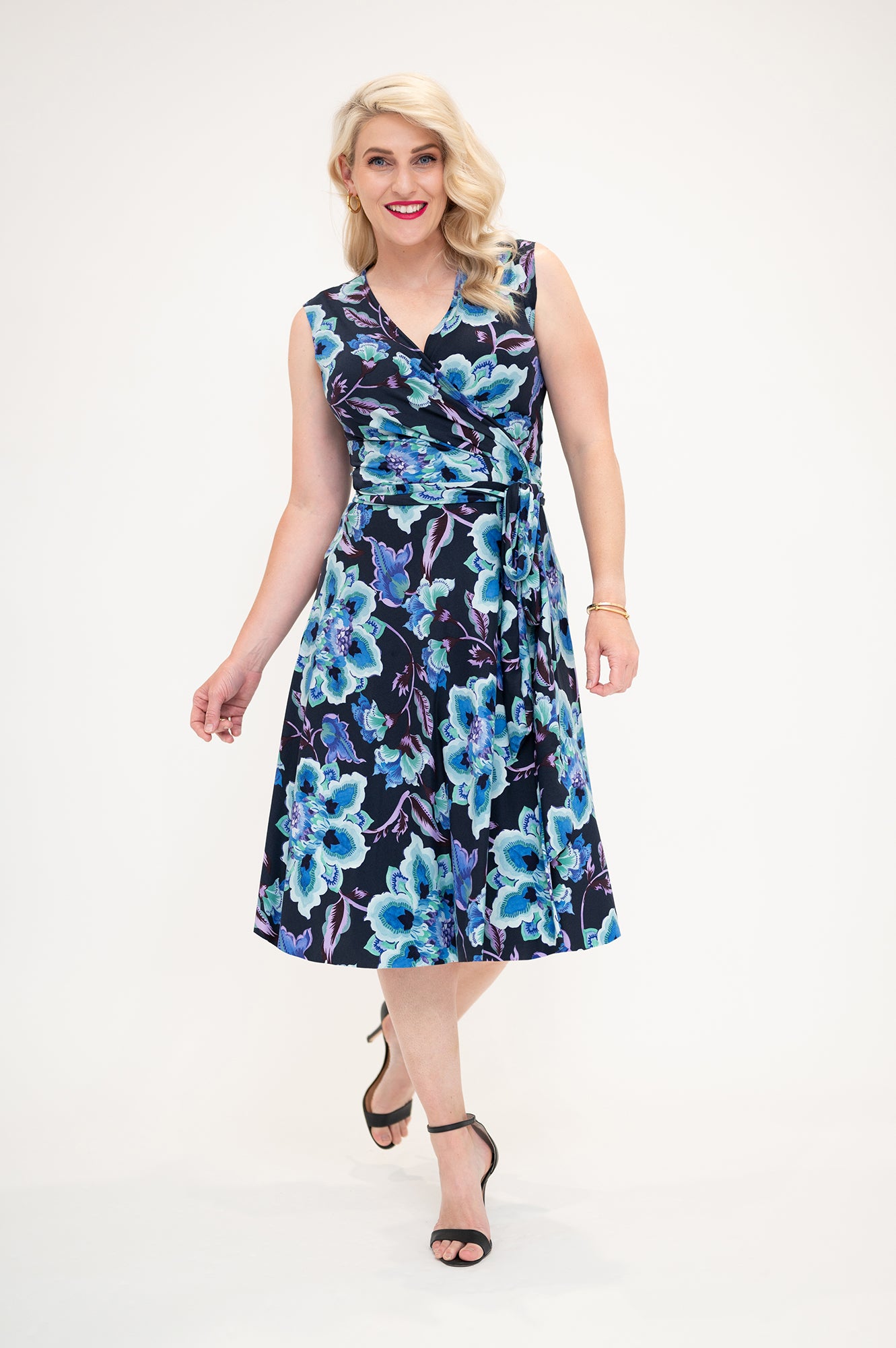 sleeveless knee length Wrap dress is available in regular and plus size dress options