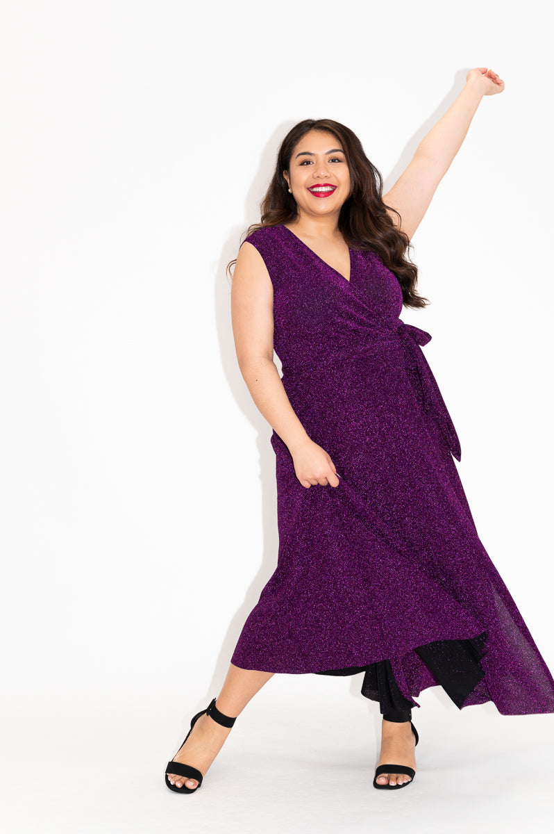 Wrap dress is available in regular and plus size dress options  metallic purple sparkly dress
