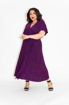 Wrap dress is available in regular and plus size dress options  sparkly wrap dress in midi with flutter sleeve