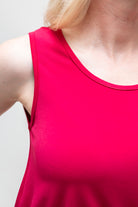 By Samantha Melbourne Erin Swing Singlet. Available in 3 colours. Made in Australia. Model wears Erin Singlet in Red. Erin Singlet is sleeveless, features Round Crew Neck, Swing style and Relaxed fit, Hip length. Closeup
