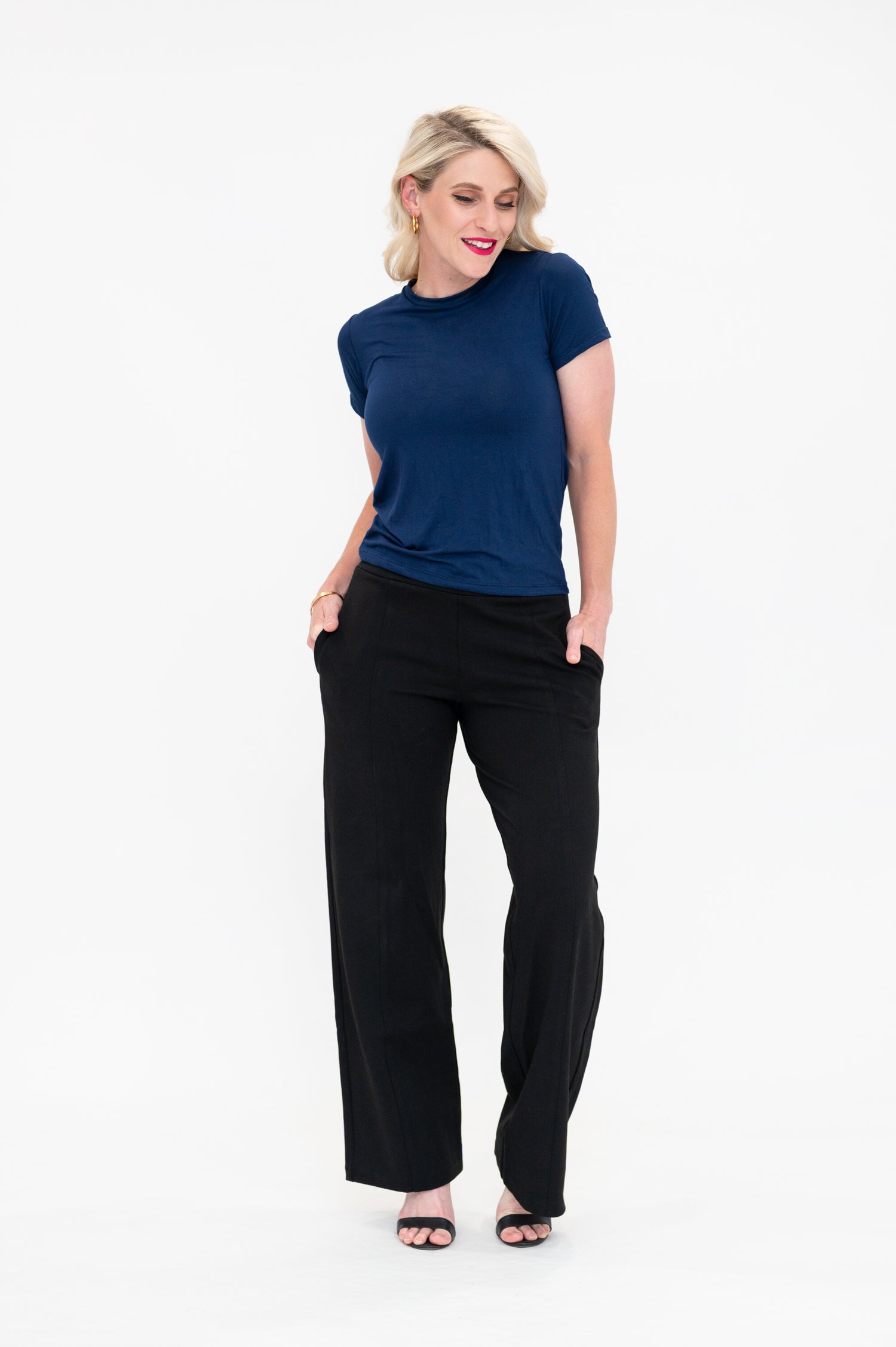 Woman wearing bamboo t-shirt in navy colour from By Samantha Melbourne. Curve-friendly fit, short sleeves, crew neck.