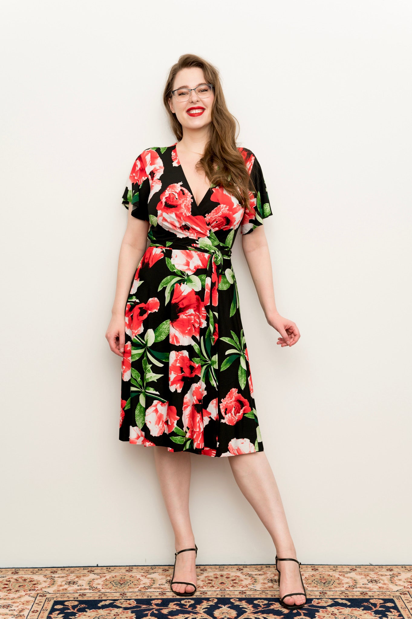 hibiscus Wrap dress is available in regular and plus size dress options - this variant is a knee length flutter  sleeve 