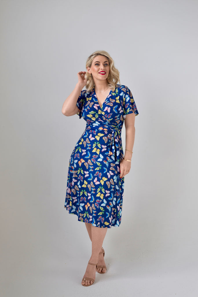 Butterfly themed  Wrap dress is available in regular and plus size dress options - this variant is a knee length  flutter sleeve 