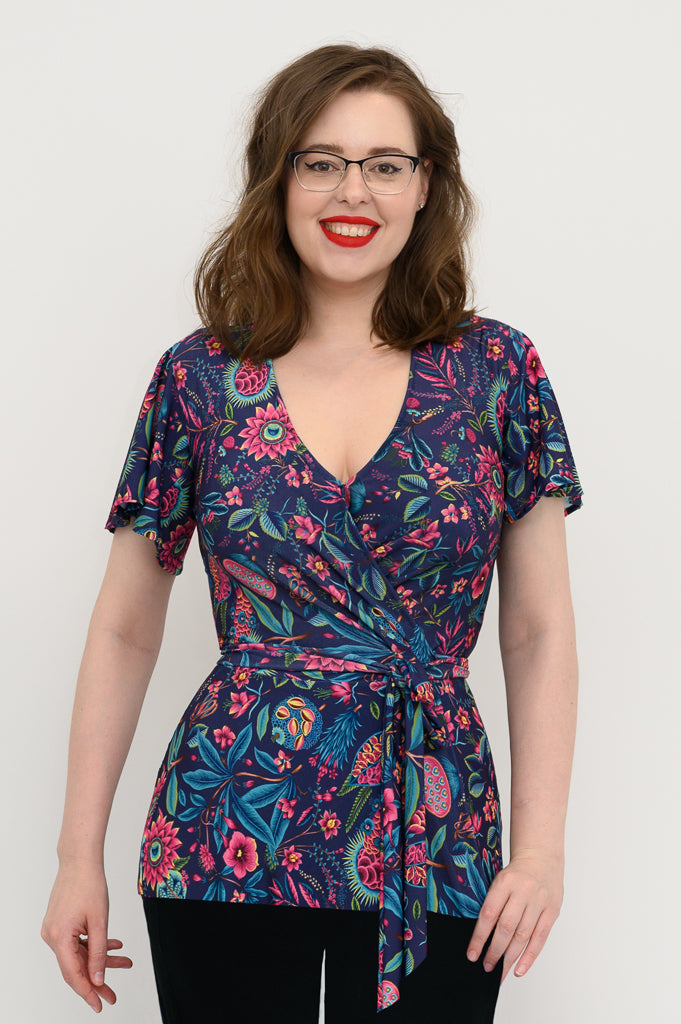 navy wrap top with florals and a flutter sleeve in plus size and regular 