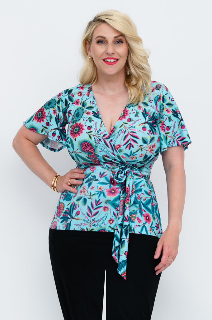 This print is available in regular and plus size wrap dress and wrap top options (6-22). blue wrap top with flutter sleeve 