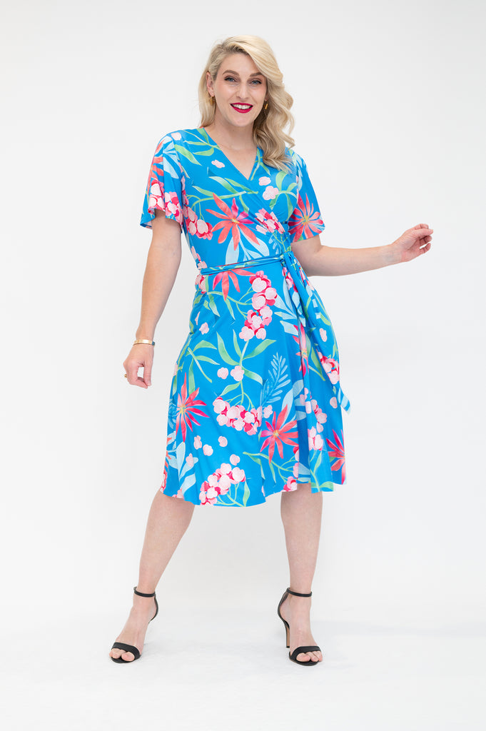 hydrangea themed  Wrap dress is available in regular and plus size dress options - this variant is a knee length  flutter sleeve 