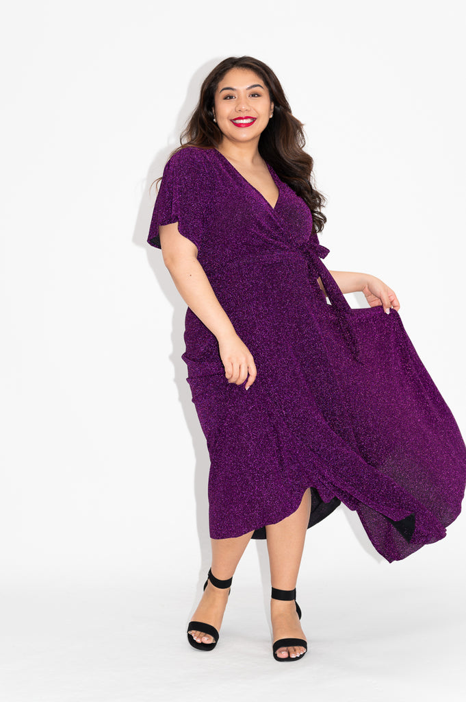 Wrap dress is available in regular and plus size dress options  metallic purple sparkly dress   flutter sleeve 