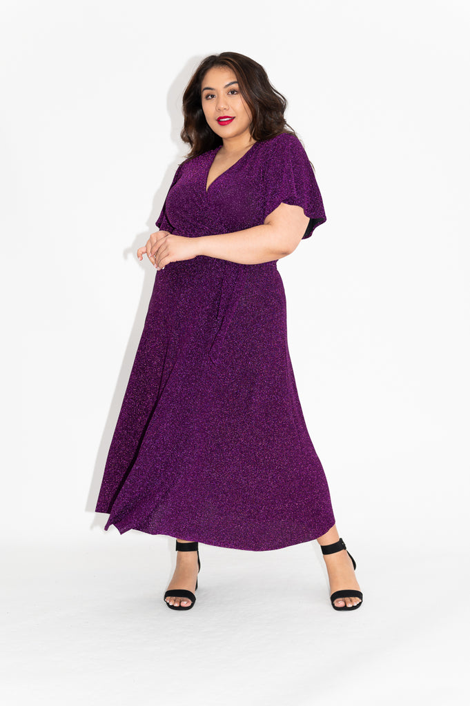 Wrap dress is available in regular and plus size dress options  sparkly wrap dress in midi with flutter sleeve 